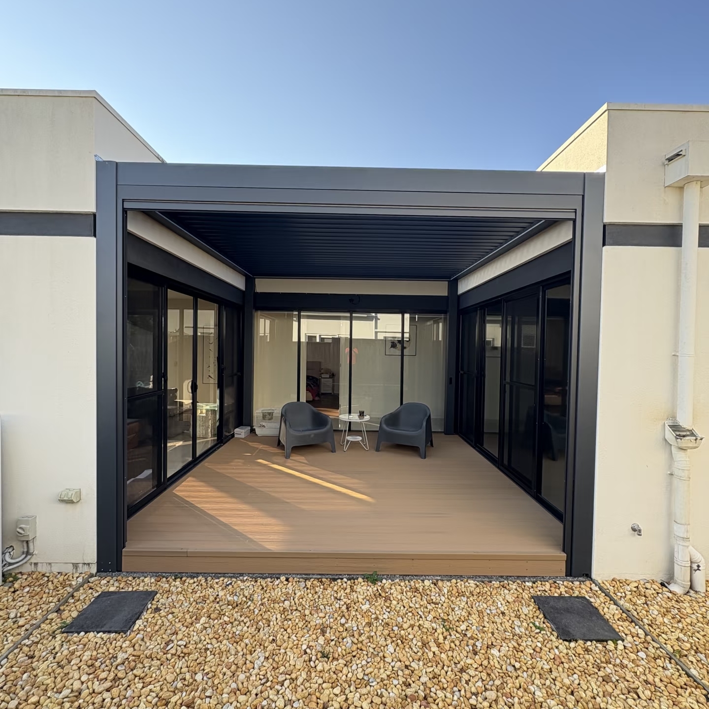 Alu180 pergola with roller blinds partially open